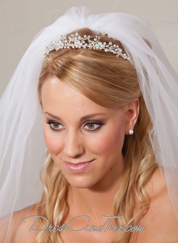 Small flowers studded with crystals adorn the tiara This wedding tiara is 